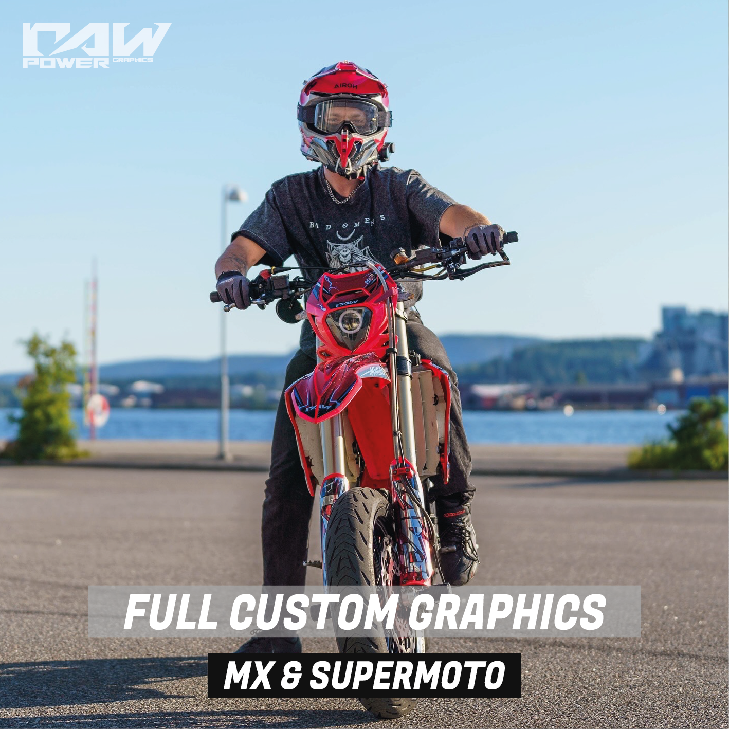 Person riding a red beta supermoto bike with 'RAW Power' branding, set against a scenic background.